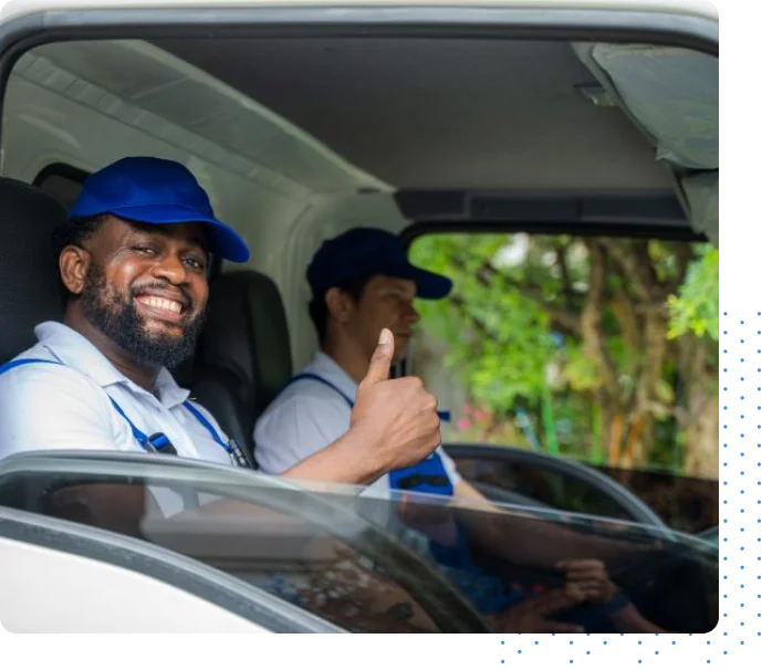 Driver sitting in car with his thumb up